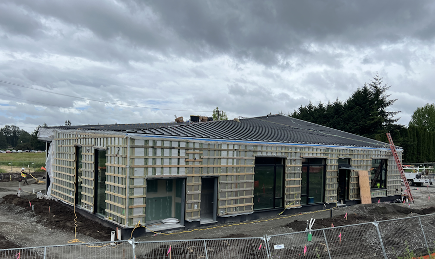 Exterior of new library covered in wooden slats to which finishes will be attached